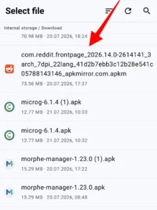 File picker screen with a red arrow pointing to a downloaded file in the Download folder.